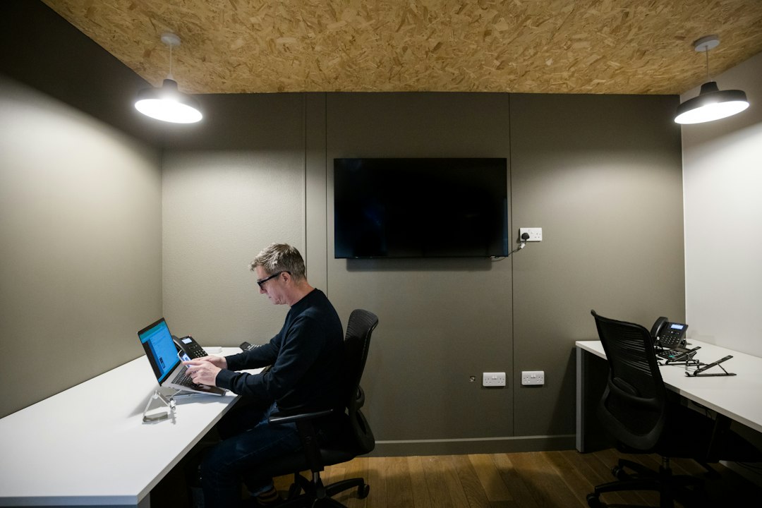 Entrepreneur working on a laptop representing self-employment and business planning